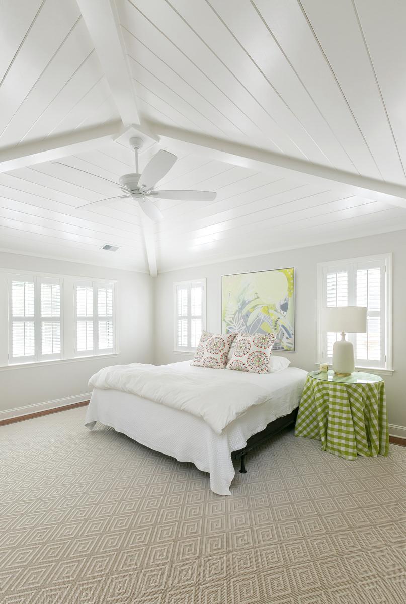 Owner suite addition with vaulted ceiling, fan and lots of natural light.