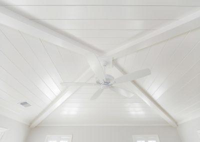 Vaulted ceiling with shiplap and new ceiling fan.