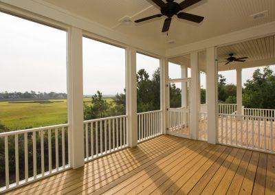 Screened porch with marshfront view from custom home builders in Charleston, South Carolina.