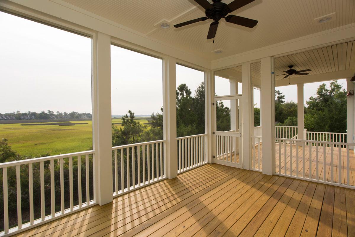 Screened porch with marshfront view from custom home builders in Charleston, South Carolina.
