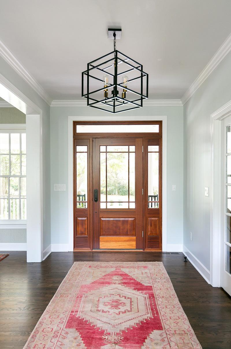 Custom renovation, grand entryway with modern aesthetics combined with classic architecture.