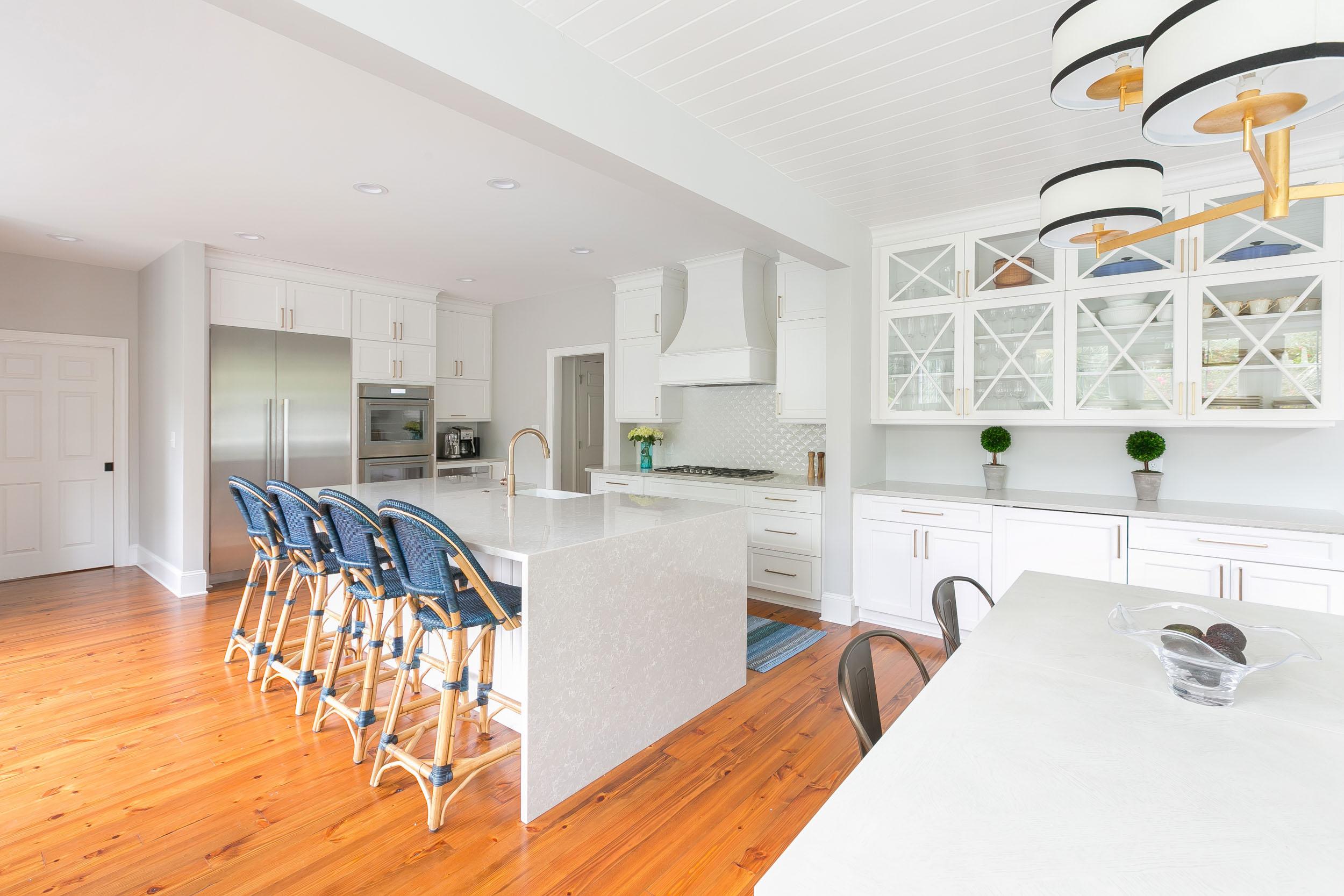 Custom kitchen with tiled backsplash, custom cabinetry and kitchen island.