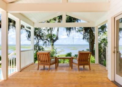 Gorgeous marsh and river view from covered deck with vaulted ceiling and exposed beams.
